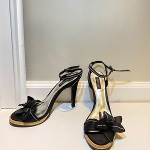 Black heels with white stitching.